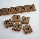 brown wooden letter blocks on white surface